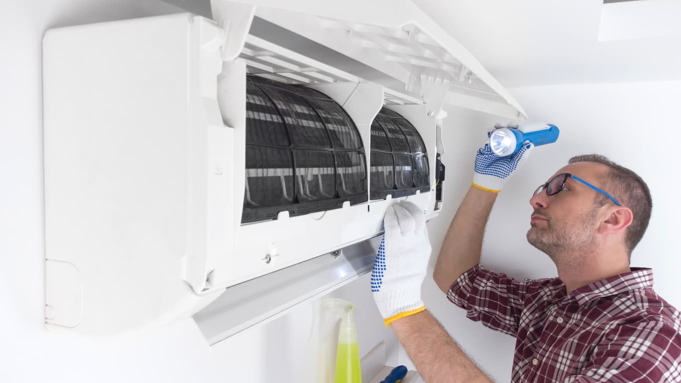Vermont Heat Pump Cleaning technician servicing a ductless mini-split